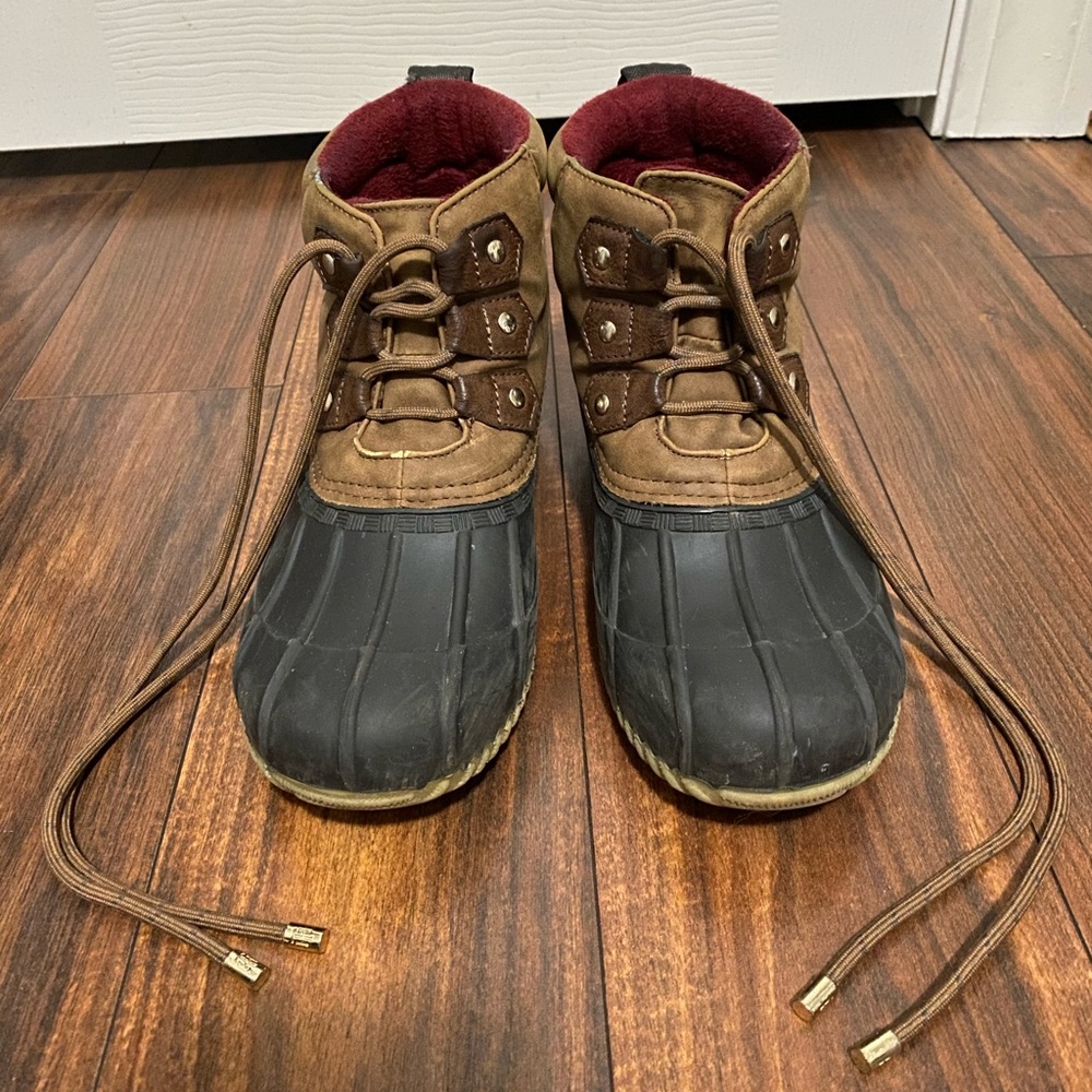 Brown and black “duck” boots.